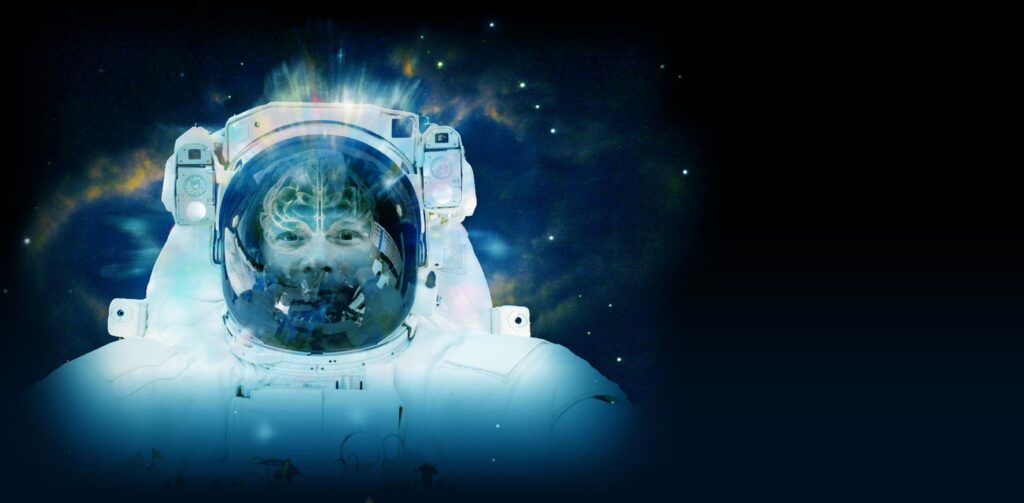 Astronaut in a suit floats against a deep space backdrop, surrounded by stars and nebula. A virtualized brain is overlaid on the helmet over the astronaut's head.